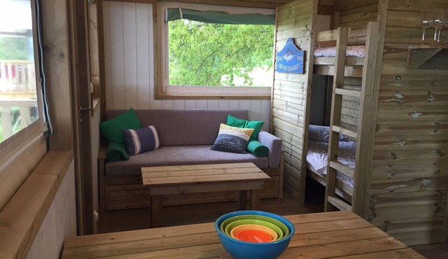 A two bedroom luxury lodge with extra cabin beds, heated covered pool