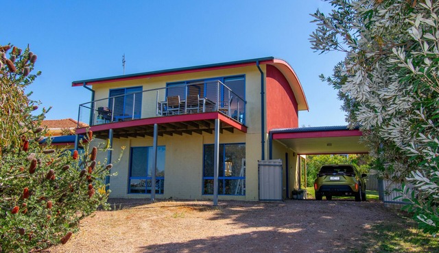 A two- story house with sweeping views of Bass Strait and the North Arm.