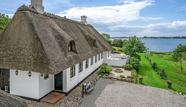 A unique gem of a vacation home located in a scenic setting right on the water.
