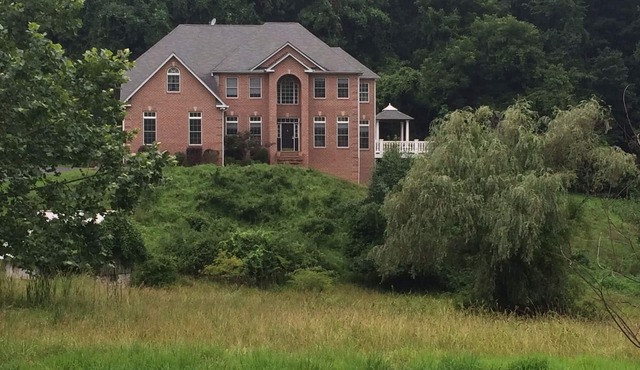 A Unique & Private Single Family Home with 5 acres of privacy.