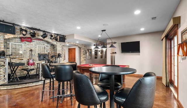A warm & inviting modern retreat featuring on-site local brews & a home theater.