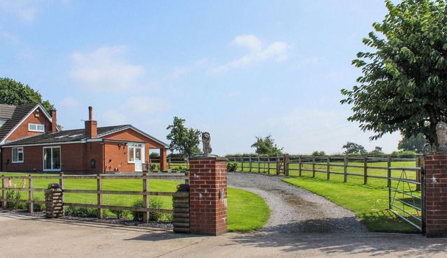 A wonderful single level property set within a working equestrian setting.