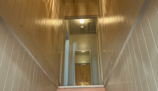 Above the pink stairs ~ a quiet eclectic garage apartment.