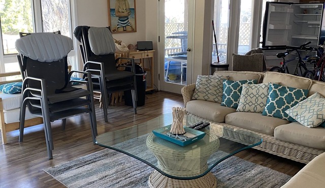 Activities included up to $300 FREE PER WEEK! FREE DAILY ACTIVITIES! Charming 3 bedroom, 2 bath beach cottage located on the canal with a dock.