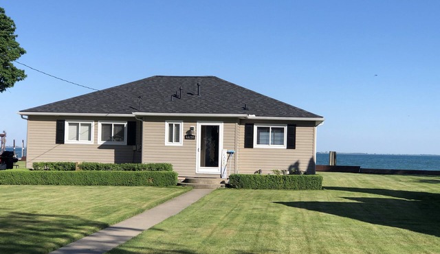 Adorable 4 bedroom lakefront home with dock on a quiet street