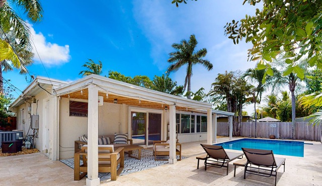 Adorable bungalow with an enclosed yard, private pool, grill, firepit, W/D, & AC