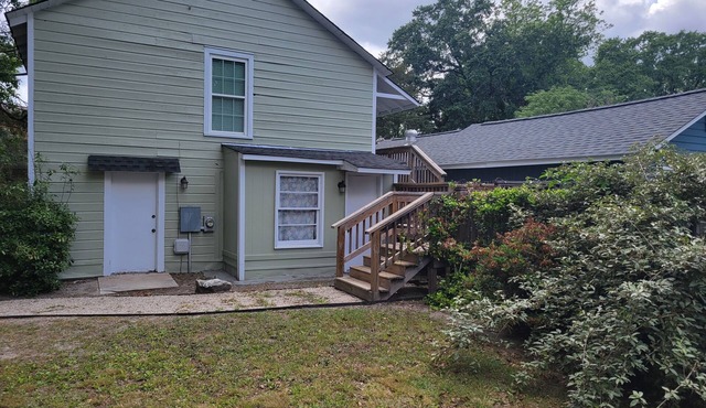 Adorable cottage in lovely gated property on beautiful Elm lined main street