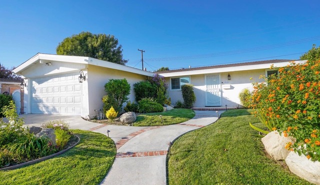 Adorable House with fireplace in backyard