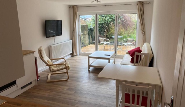 Adorable One-Bedroom Flat With Patio Garden.