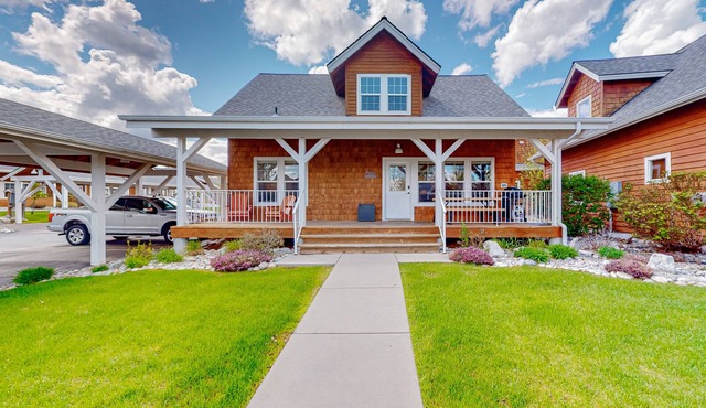Adorable, two-story home with a furnished front porch, fireplace, & washer/dryer