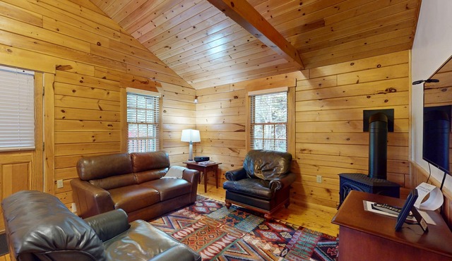 Adventure starts here in this dog-friendly cabin with kitchen, firepit & trails