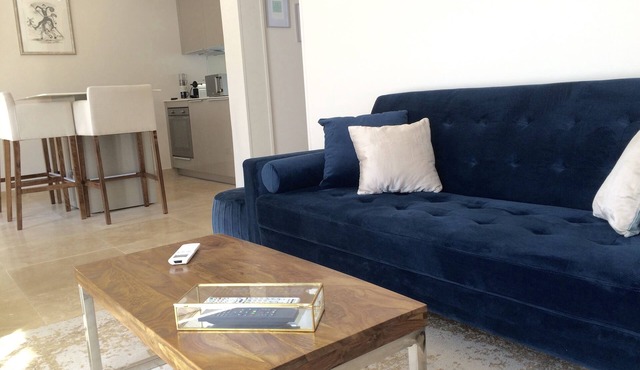 Air-conditioned apartment with large terrace on property with swimming pool