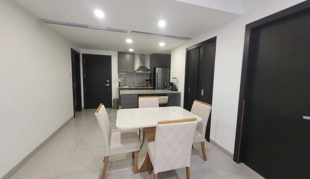 Airport-Ready 2BR Gem by Mall del Sol AC + Fitness + Fast WiFi