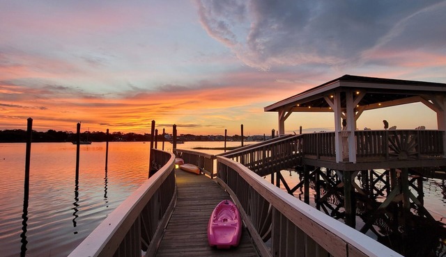 "All About the Views" is ON THE WATER - one block walk to the Beach Side!