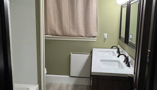All one floor Charming large 2 bedroom, LR, sunroom, kitchen 2 baths wt laundry.
