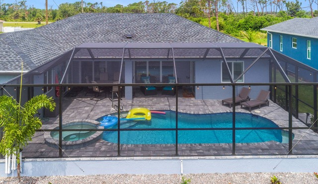 ALL the amenities! 3bd 2 bath with hot tub, on canal, dock, pool heat included!