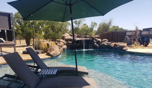 Althea House features a pool, firepit, grilling station, and friendly goats!