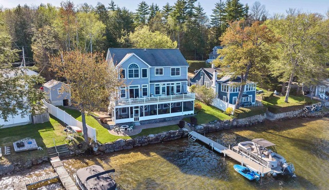 Amazing 4 bed/4 bath home right on Lake Winnisquam w terrific views, hot tub