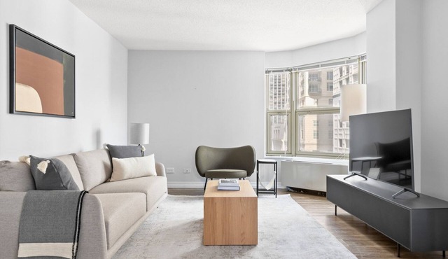 Amazing Gold Coast 1BR w/Deck, Gym & Lounge, 1 block to L, by Blueground