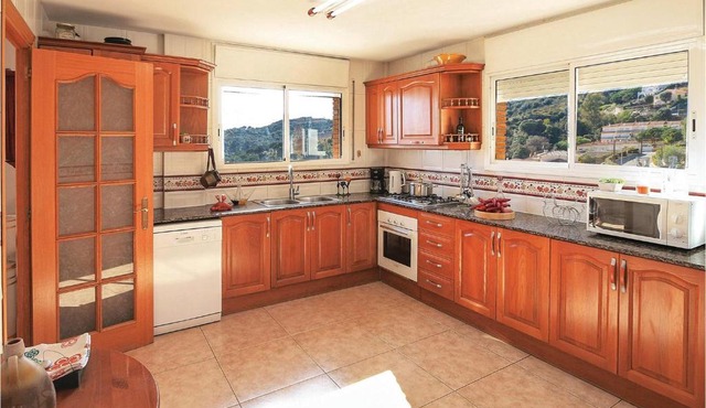 Amazing home in Alella with 5 Bedrooms, WiFi and Swimming pool