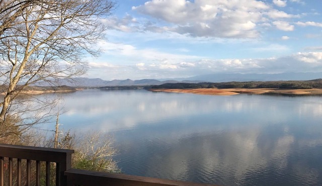 Amazing Lake and Smoky Mountain Views from this Charming Lake House.