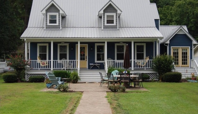 Amazing Lake house with a great yard and boathouse with a party deck.