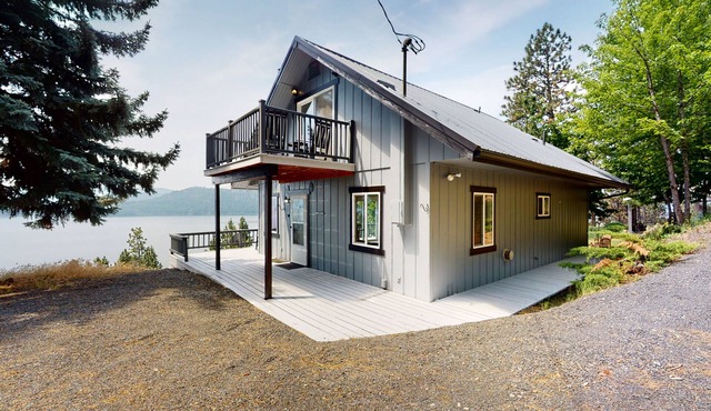 Amazing lake-view cabin with balcony, firepit, grill, wood stove, & W/D