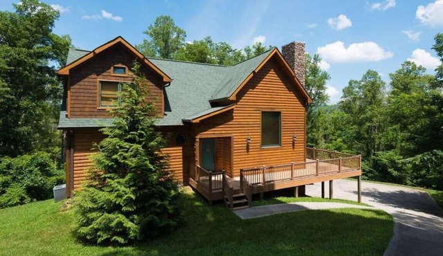 Amazing log and stone home with a mountain setting and view of Norris Lake!
