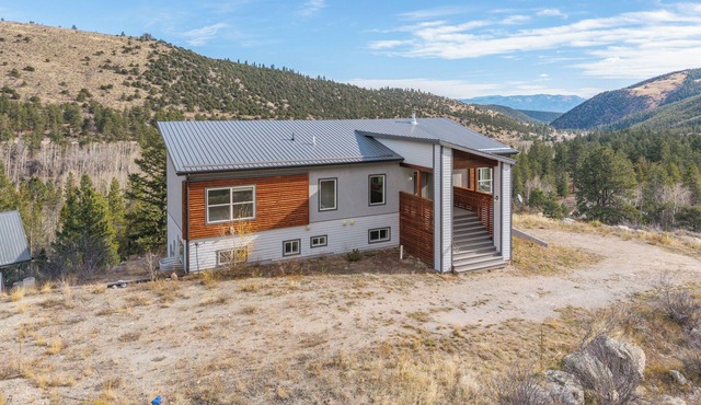 Amazing modern mountain home perched high on a hill overlooking breathtaking 360 panoramic views, yet only one minute off highway 50. You're minutes away from the Colorado trail that takes you to the Continental Divide.