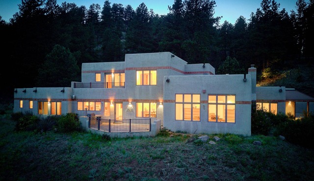 Amazing mountain home on 126 acres bordering national forest land