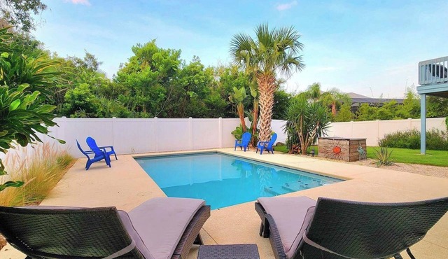 Amazing Tropical Pool Home with Breezy Outdoor Living Space just Steps to Beach.