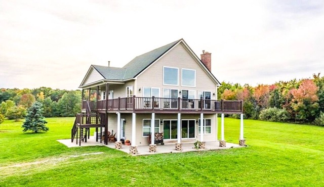 Amenity packed home set on 40 acres with sweeping views of Canandaigua Lake.