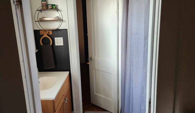 "Ames House" Cozy, Country Charm, offers 4 beds, 1 bath, spacious living room.