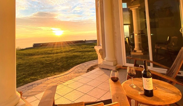 An elegant B&B with a pool & hot tub located above Moose Mountain Vineyards