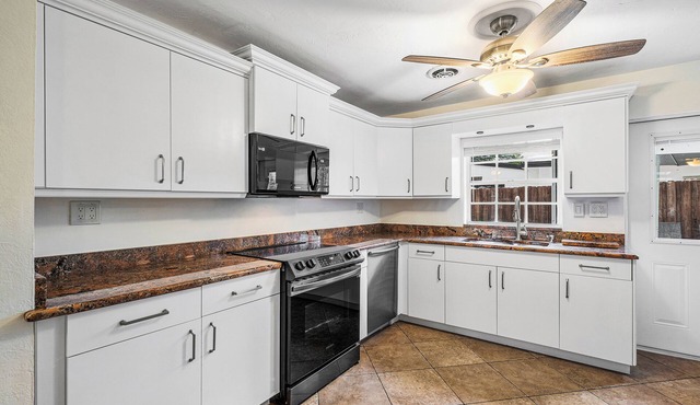 An elegant oasis, surrounded by palm trees, private backyard, close to the beach