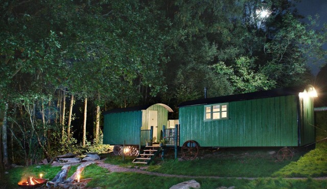 Anne's Hut offers a romantic retreat for two in two interlinked shepherd's huts with decking area an
