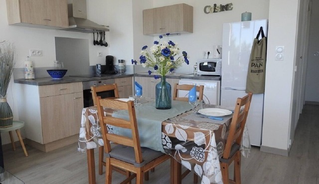 Apartment located on the ground floor of a small residence with four