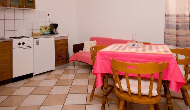 Apartment on the seafront of the island of Rab with private beach