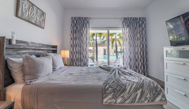 Apartment steps from the beach and overlooking the pool