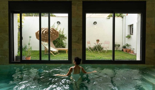 Apartment with heated pool and garden.