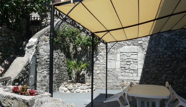 Appt in listed village on river bank, with terrace and barbecue
