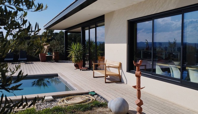 Architect-designed house in a subdivision with views and a swimming pool not overlooked