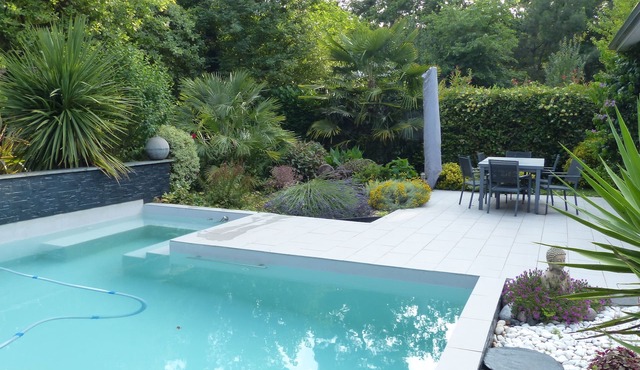 Architectural villa with private pool in a green setting