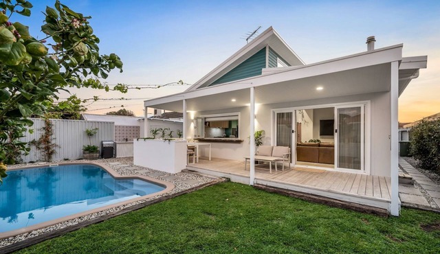 Architecturally designed coastal home with pool. Walk to cafes, pet friendly.