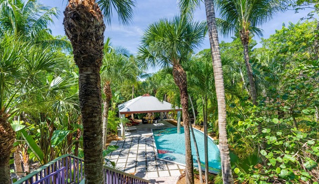 Architecturally stunning, home with the feel of a Balinese resort. Ready for guests post Ian