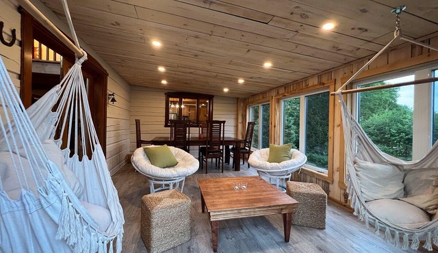 At the edge of a navigable lake offering dazzling sunsets.