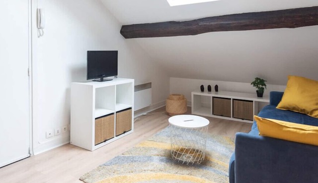 Attic apartment with exposed beams