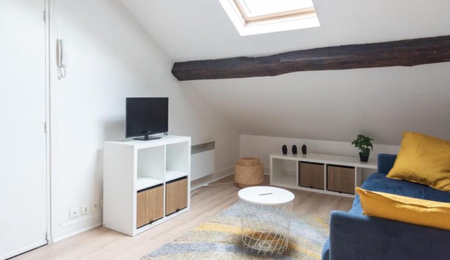 Attic apartment with exposed beams