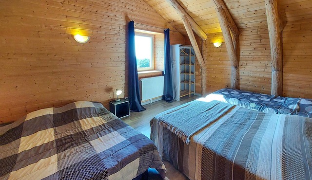 Attractive vacation home made of wood and stone with space for the whole family.