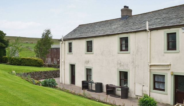 Attractive farm cottage with period features and views over fields and fells.